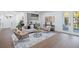 Bright living room featuring a bar area and access to the outdoors through glass doors at 7017 Via Carmel Way, Orlando, FL 32819