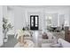 Open floor plan with ample natural light creates a spacious and inviting atmosphere for modern living at 7017 Via Carmel Way, Orlando, FL 32819