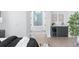Chic bedroom featuring wet bar, modern decor, and bathroom access for relaxation at 7017 Via Carmel Way, Orlando, FL 32819