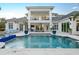 The backyard boasts a sparkling pool and ample patio space, perfect for outdoor relaxation at 7017 Via Carmel Way, Orlando, FL 32819