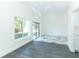 Bright dining room with gray vinyl plank and marble tile flooring at 8 Chip Ct, Kissimmee, FL 34759