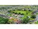 Aerial view of a residential neighborhood showing homes, green spaces, and a community at 1111 Knightsbridge Cir, Davenport, FL 33896