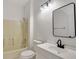Neat bathroom, featuring a bathtub, toilet and white vanity at 1135 Madeira Key Way Way, Orlando, FL 32824