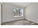 Bright bedroom with gray wood flooring and a large window at 1135 Madeira Key Way Way, Orlando, FL 32824
