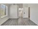 Primary bedroom with wood-look floors and access to the bathroom at 1135 Madeira Key Way Way, Orlando, FL 32824
