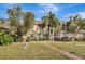 Two-story townhome with a landscaped yard and walkway at 1135 Madeira Key Way Way, Orlando, FL 32824