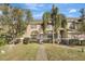 Two-story townhome with a landscaped yard and walkway at 1135 Madeira Key Way Way, Orlando, FL 32824