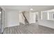 Spacious living area featuring gray vinyl flooring and an open concept to the kitchen at 1135 Madeira Key Way Way, Orlando, FL 32824