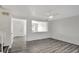Open living area with wood-look floors and views into other rooms of the home at 1135 Madeira Key Way Way, Orlando, FL 32824