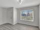 Bright living room with gray flooring and a large window at 1135 Madeira Key Way Way, Orlando, FL 32824