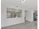 Open concept living area with kitchen view and access to screened patio at 1135 Madeira Key Way Way, Orlando, FL 32824