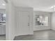 Bright living room with gray flooring and a large window at 1135 Madeira Key Way Way, Orlando, FL 32824