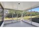 Screened porch overlooking backyard with lush greenery at 1135 Madeira Key Way Way, Orlando, FL 32824