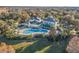 Community pool with surrounding lounge chairs and landscaping at 114 Watling Way # 114, Davenport, FL 33897