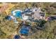 Community pool, clubhouse with solar panels, and shuffleboard at 114 Watling Way # 114, Davenport, FL 33897