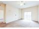 Spacious bedroom with balcony access and ceiling fan at 114 Watling Way # 114, Davenport, FL 33897