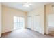 Bedroom with double closets and access to bathroom at 114 Watling Way # 114, Davenport, FL 33897