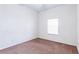 Simple bedroom with carpeted floor and window at 114 Watling Way # 114, Davenport, FL 33897