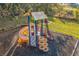 playground with slide, climbing wall, and tire features at 114 Watling Way # 114, Davenport, FL 33897