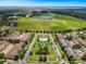 Wide view of community, including green spaces and lake at 12411 Mossy Oak Dr, Orlando, FL 32832