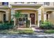 Front exterior of the house with landscaping and walkway at 12411 Mossy Oak Dr, Orlando, FL 32832