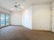 Bright bedroom with french doors to a balcony with wrought iron details, enhancing the room's charm at 125 Stone Hill Dr, Maitland, FL 32751