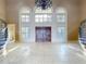 Bright foyer with double front doors, large arched windows, and dual staircase at 125 Stone Hill Dr, Maitland, FL 32751