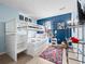 Charming bedroom with a bunk bed, colorful rug, and decor at 136 Pompano Beach Dr, Kissimmee, FL 34746