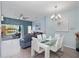 A relaxing living area featuring a ceiling fan, modern decor, and view of the water at 136 Pompano Beach Dr, Kissimmee, FL 34746