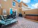 Spacious patio with outdoor furniture, a grill, and a relaxing hot tub at 136 Pompano Beach Dr, Kissimmee, FL 34746