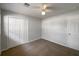 Bedroom with double door closet and neutral walls at 1361 Peters Dr, Leesburg, FL 34748