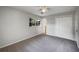 Bedroom with carpet floors, ceiling fan and access to bathroom at 1361 Peters Dr, Leesburg, FL 34748