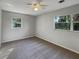 Simple bedroom with neutral colored walls and carpet at 1361 Peters Dr, Leesburg, FL 34748