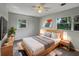 Spacious bedroom with a large bed and plenty of light at 1361 Peters Dr, Leesburg, FL 34748