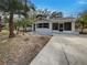 Newly painted house with a spacious yard and driveway at 1361 Peters Dr, Leesburg, FL 34748