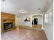 Living room features a stone fireplace and tile floors at 1361 Peters Dr, Leesburg, FL 34748