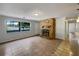 Bright living room with tile floors and a stone fireplace at 1361 Peters Dr, Leesburg, FL 34748