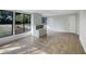Sunroom features built-in shelving and access to the backyard at 1361 Peters Dr, Leesburg, FL 34748