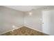 Well-lit bedroom with tile flooring and a door at 1490 Lake Opal Dr, Apopka, FL 32703