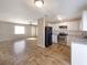 Open kitchen with white cabinets and stainless steel appliances at 1490 Lake Opal Dr, Apopka, FL 32703