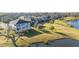 Aerial view of house and neighborhood with lake access at 15107 Lake Claire Overlook Dr, Winter Garden, FL 34787
