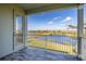 Peaceful balcony view overlooking a serene lake and lush landscape at 15107 Lake Claire Overlook Dr, Winter Garden, FL 34787