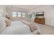 Bright bedroom with large windows and dresser at 15107 Lake Claire Overlook Dr, Winter Garden, FL 34787