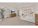 Main bedroom with large windows and dresser at 15107 Lake Claire Overlook Dr, Winter Garden, FL 34787