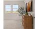 Main bedroom with large windows and dresser at 15107 Lake Claire Overlook Dr, Winter Garden, FL 34787