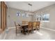 Elegant dining room with large wooden table and chandelier at 15107 Lake Claire Overlook Dr, Winter Garden, FL 34787