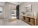 Bright and airy entryway with console table and storage baskets at 15107 Lake Claire Overlook Dr, Winter Garden, FL 34787