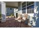 Relaxing front porch with wicker chairs and view of the neighborhood at 15107 Lake Claire Overlook Dr, Winter Garden, FL 34787