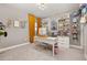 Spacious home office with built-in shelving and window at 15107 Lake Claire Overlook Dr, Winter Garden, FL 34787