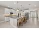 Spacious kitchen with island, stainless steel appliances, and white cabinetry at 15107 Lake Claire Overlook Dr, Winter Garden, FL 34787
